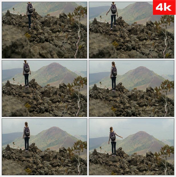 4K0274女旅行者站在山脚看风景 高清实拍视频素材