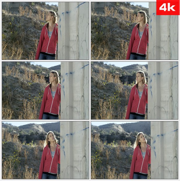 4K0293美女站在墙角甩动头发 向远方望去 高清实拍视频素材