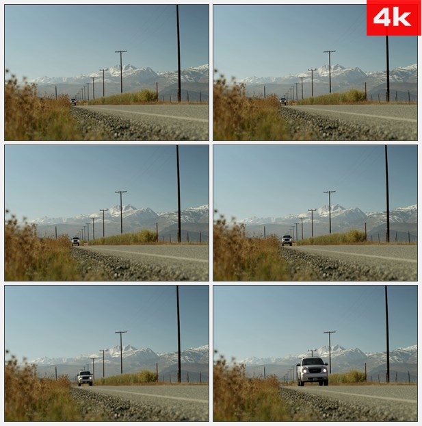 4K0368卡车从远方驶过 远处的雪山 路旁的电线杆 高清实拍视频素材
