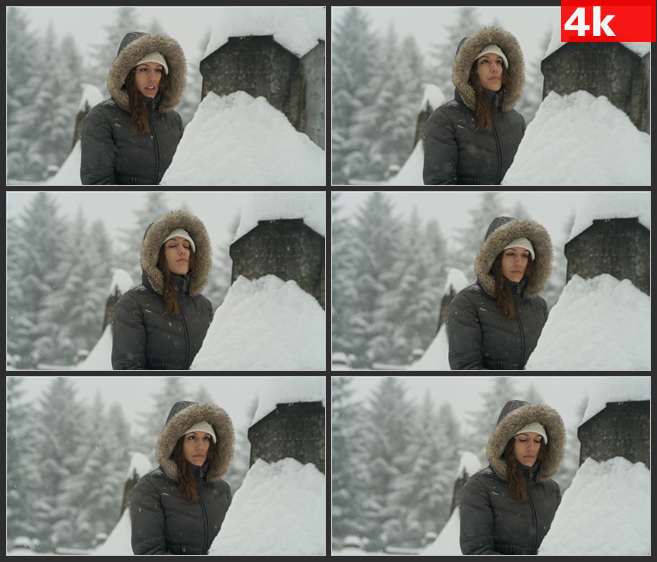 4K0675暴风雪中墓碑前的女人 高清实拍视频素材