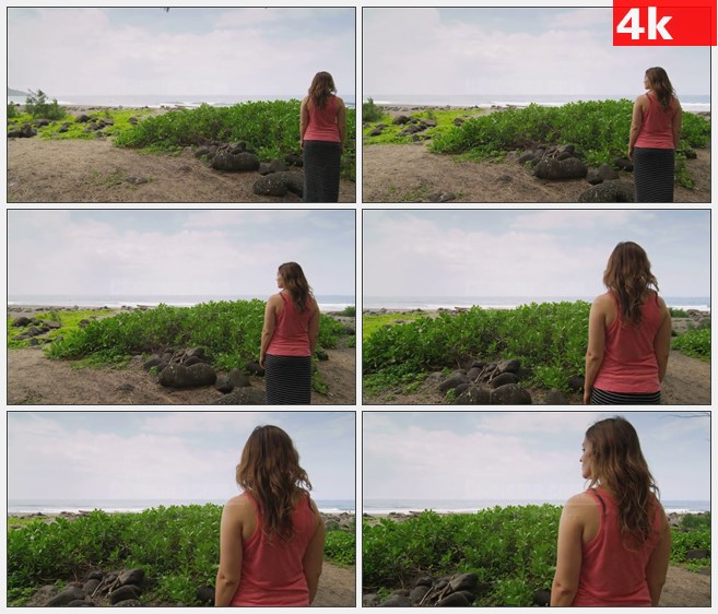 4K1280女孩面向大海欣赏海边风景绿色灌木高清实拍视频素材