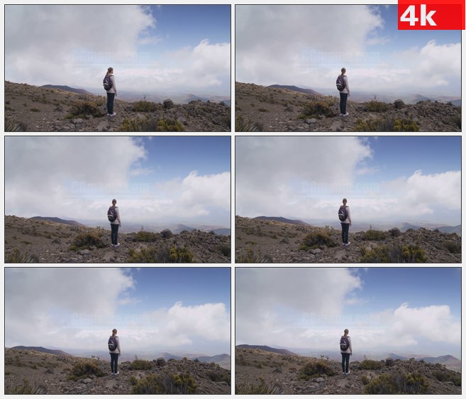 4K1412徒步旅行者站在山顶看风景高清实拍视频素材