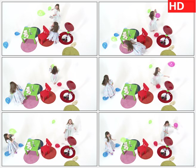 ZY1524八岁的双胞胎女孩穿着裙子在开心的玩气球有儿童桌椅在房间高清实拍视频素材