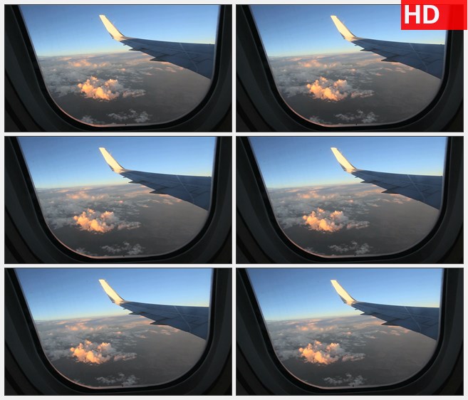 ZY1556从飞机中透过机窗看外面的蓝天白云景象高清实拍视频素材