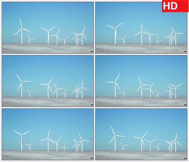 ZY1687浅蓝色天空乳白色土地上风电场中的风车随风转动高清实拍视频素材