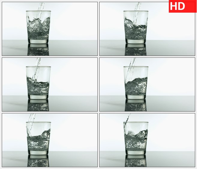 ZY1772向桌上的空水杯中倒入水的慢镜头特写2高清实拍视频素材