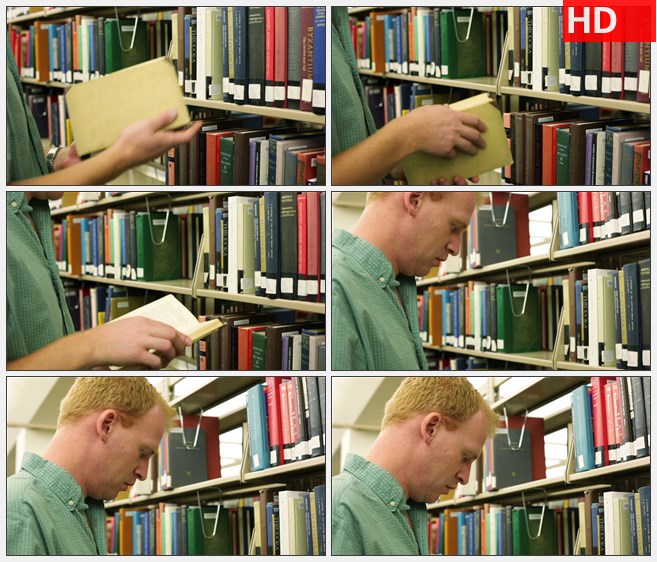 ZY1793学生拿下书架上的一本书认真翻阅高清实拍视频素材